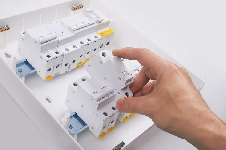 Close-up of electrical protection devices inside a switchboard